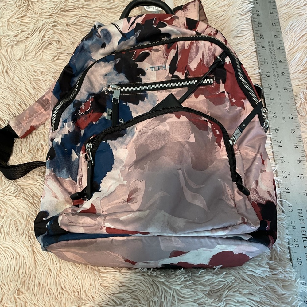 Like new Tumi backpack, floral pattern